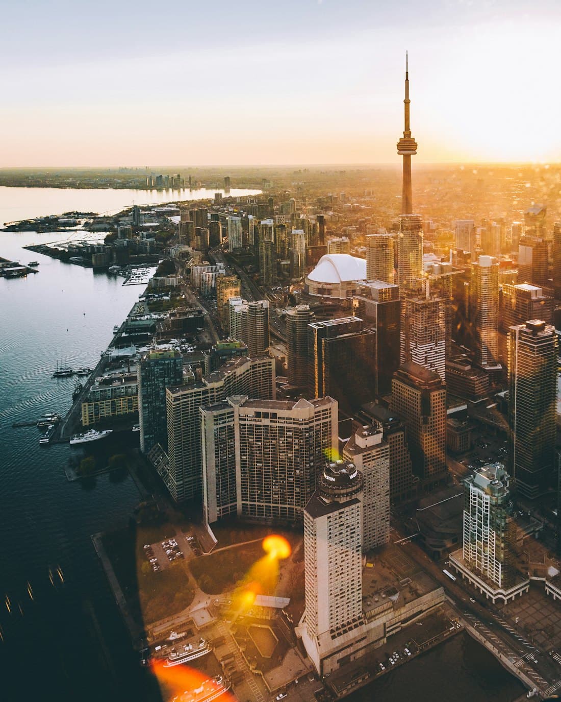 Aerial view of the Toronto skyline and CN Tower at sunset